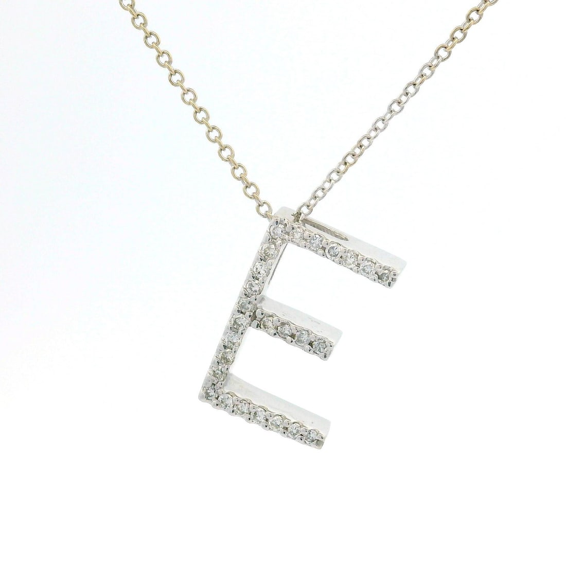 14k White Gold E Initial Pendant Necklace with 0.13ct Diamonds: 14k White Gold E Initial Pendant Necklace with 0.13ct Diamonds This exquisite 14k White Gold necklace features a stunning "E" initial slide pendant adorned with 26 natural genuine diamonds. The