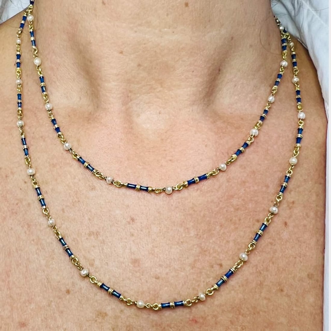 18K Yellow Gold Pearl Necklace with Blue Enamel 36 Inch: 18K Yellow Gold Pearl Necklace with Blue Enamel 36 Inch This exquisite necklace features a stunning combination of 18K yellow gold, natural pearls, and blue enamel. Measuring 36 inches in length and w