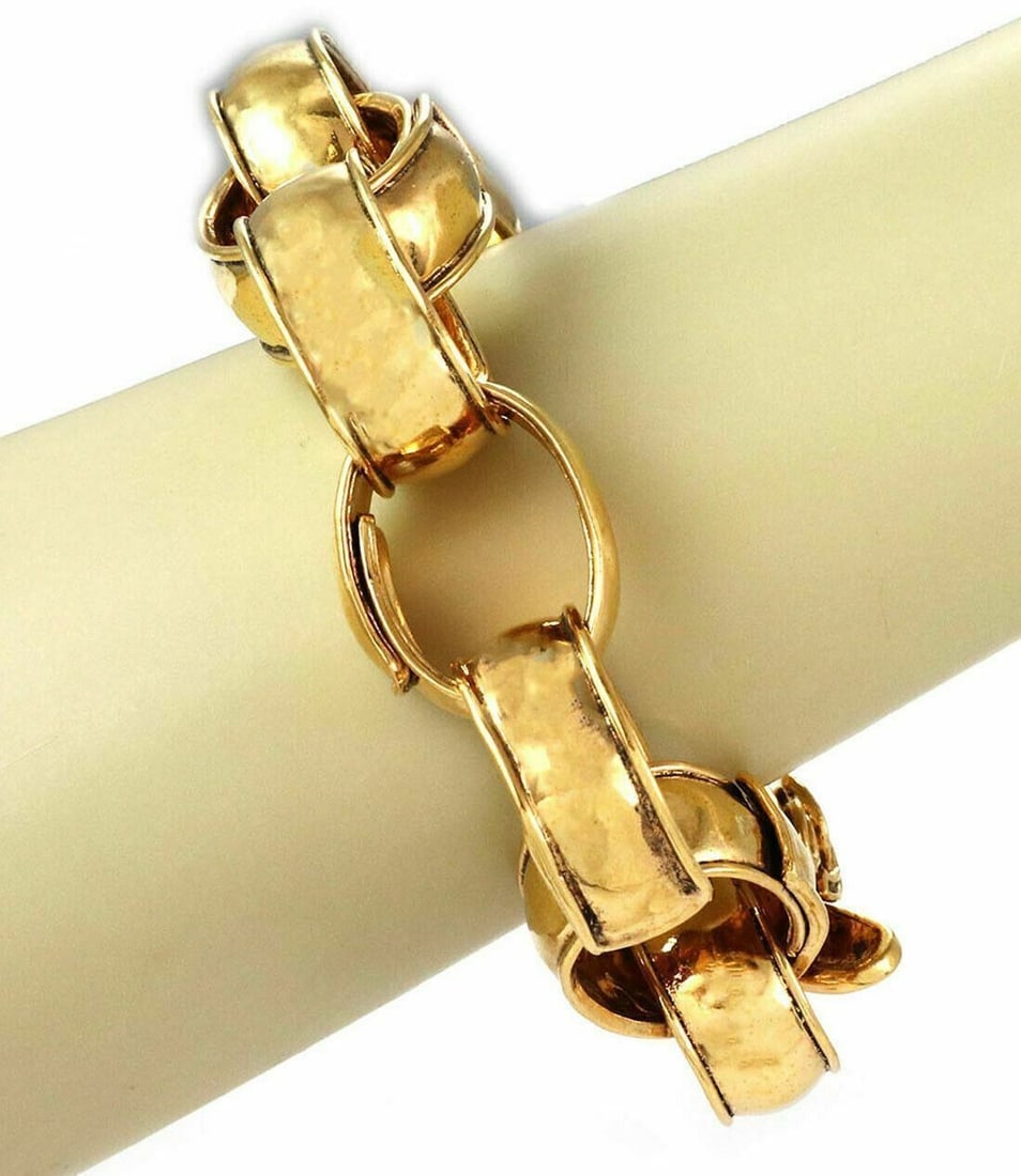 Vintage Chanel 92P Hammered Oval Link Gold Plated Toggle Bracelet 8 Inch: Vintage Chanel 92P Hammered Oval Link Gold Plated Toggle Bracelet 8 Inch This vintage Chanel 92P bracelet features large hammered oval links crafted from yellow gold plated metal. The toggle clasp pro