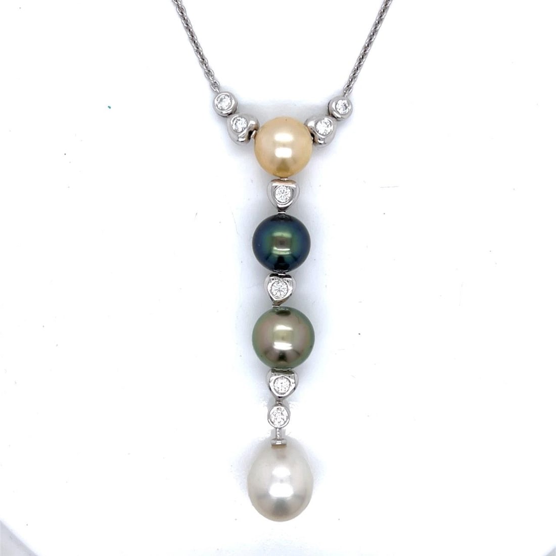 South Sea Pearl and Diamond Pendant Necklace in 18K White Gold: South Sea Pearl and Diamond Pendant Necklace in 18K White Gold This necklace features four South Sea pearls and eight diamonds set in 18K white gold. The diamonds have an approximate total weight of 0