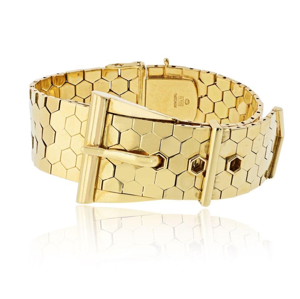 IWC Vintage Timepiece Crafted in 18K Yellow Gold: IWC Vintage Timepiece Crafted in 18K Yellow Gold This vintage IWC watch is crafted from 18K yellow gold and weighs 125 grams. It is a pre-owned timepiece known for its classic style and renowned brand