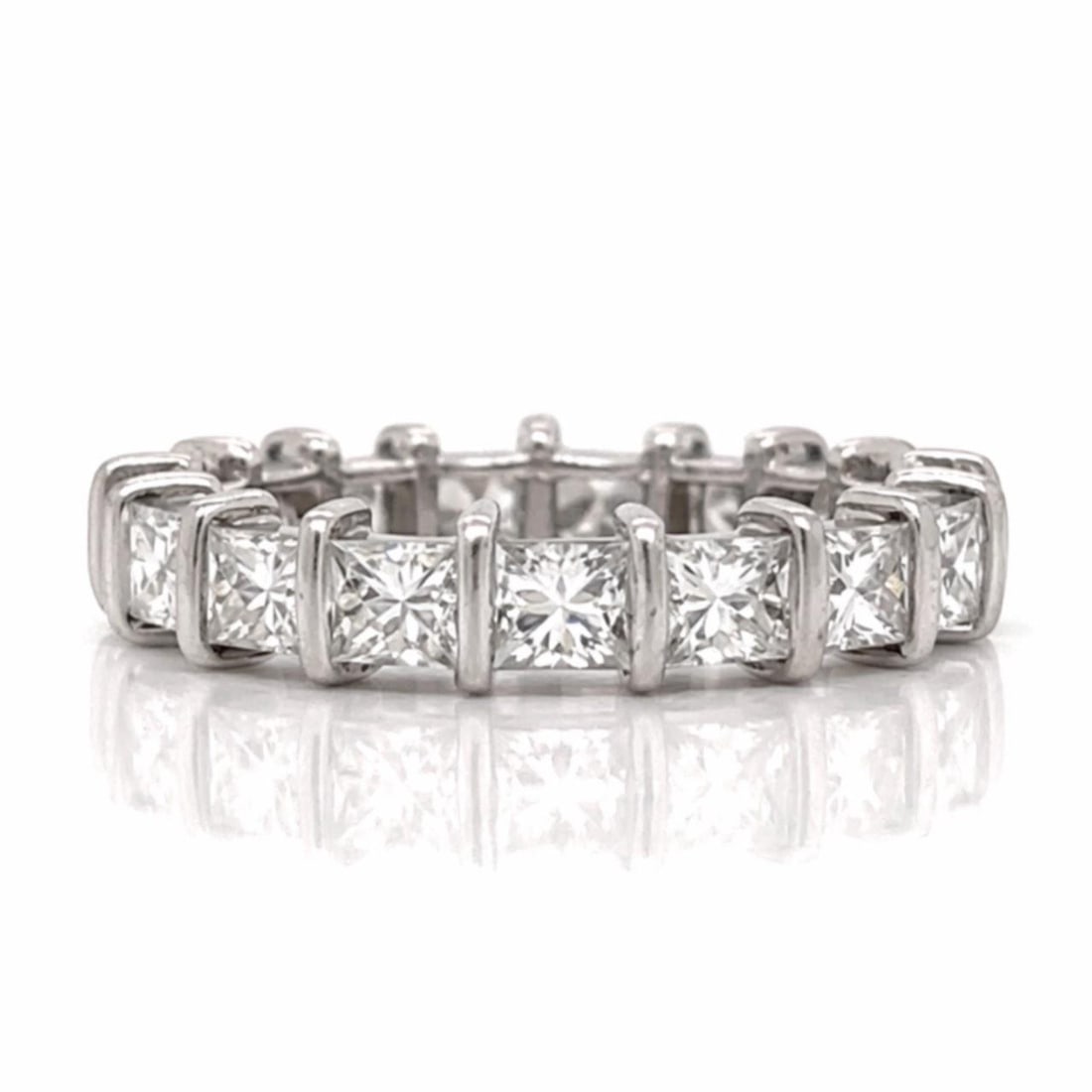 Eternity Ring in Platinum with 3.40 Ct Princess Cut Diamonds Size 5: Eternity Ring in Platinum with 3.40 Ct Princess Cut Diamonds Size 5 This platinum eternity band features 17 princess-cut diamonds with a total weight of approximately 3.40 carats. The diamonds are H-I