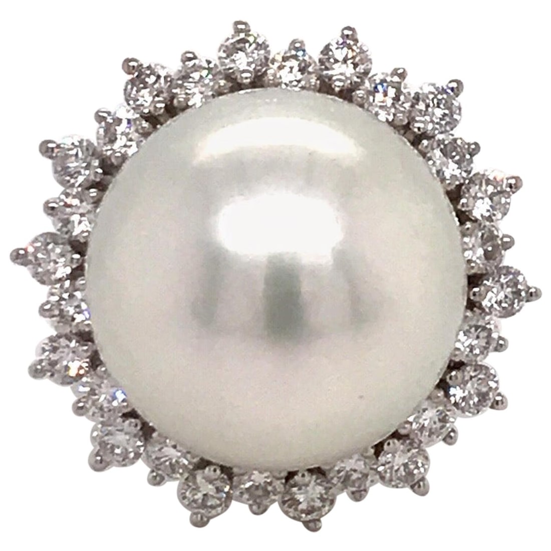Harbor Diamonds 18K White Gold South Sea Pearl Diamond Halo Ring: Harbor Diamonds 18K White Gold South Sea Pearl Diamond Halo Ring This exquisite 18K white gold ring showcases a stunning South Sea Pearl measuring 14-15 mm, elegantly framed by a halo of 28 round bril