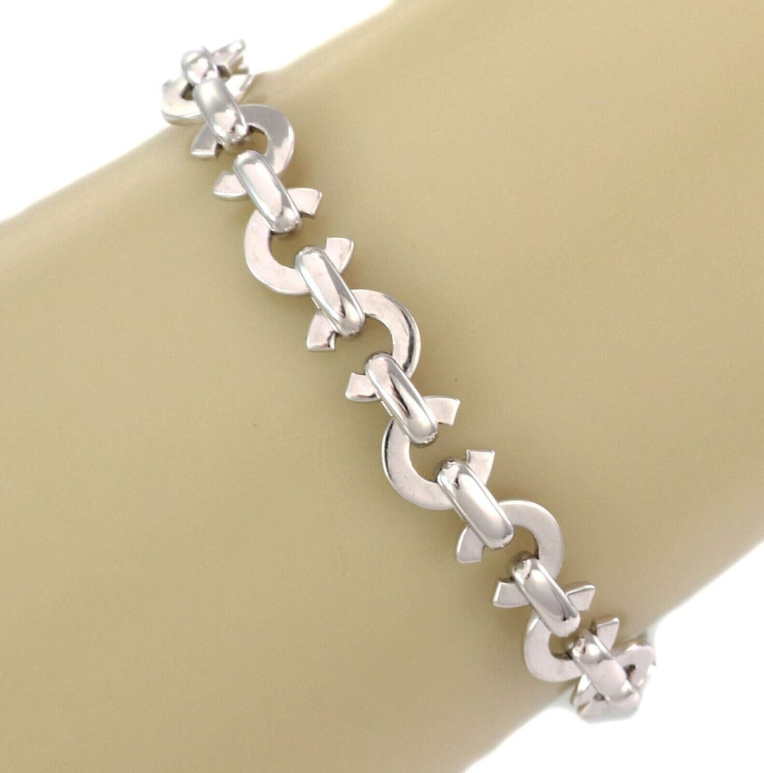 18k White Gold C Link Bracelet by Chanel Signed Italian Design: 18k White Gold C Link Bracelet by Chanel Signed Italian Design This authentic Chanel bracelet is crafted from solid 18k white gold and features a classic C link design with a polished finish. Signed a