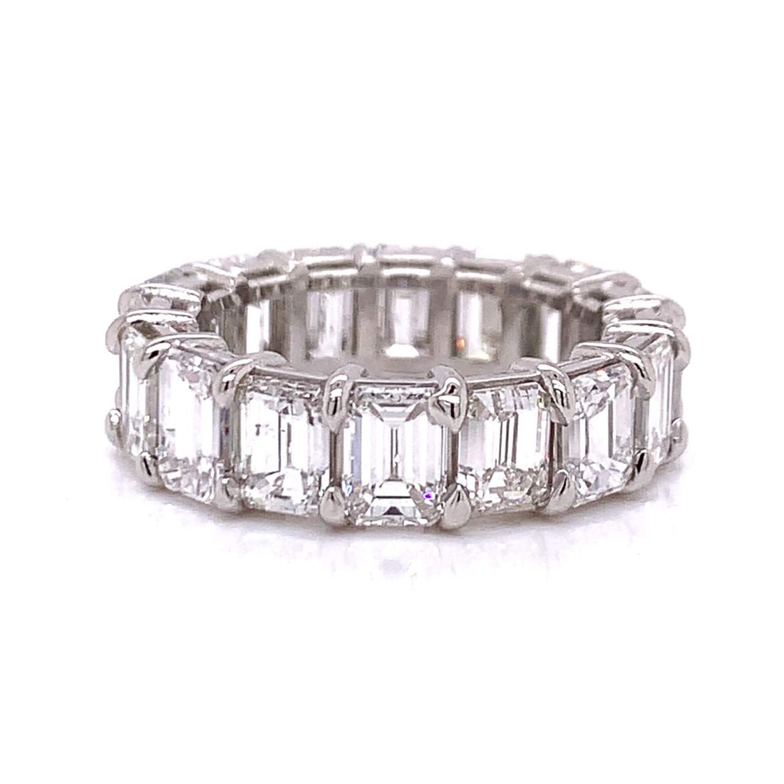 Platinum 9.50 Ct Emerald-Cut Diamond Eternity Band: Platinum 9.50 Ct Emerald-Cut Diamond Eternity Band This stunning Platinum Diamond Eternity Band features a total weight of approximately 9.50 carats, beautifully set with 16 emerald-cut diamonds. The