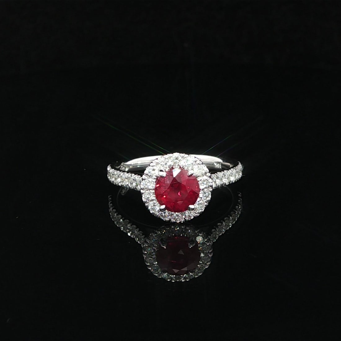 14k White Gold Ruby Diamond Halo Ring by C. Dunaigre 1.33ct No Heat: 14k White Gold Ruby Diamond Halo Ring by C. Dunaigre 1.33ct No Heat This exquisite cocktail ring showcases a stunning 1.33ct vivid red round ruby, which is a natural gemstone sourced from Mozambique a