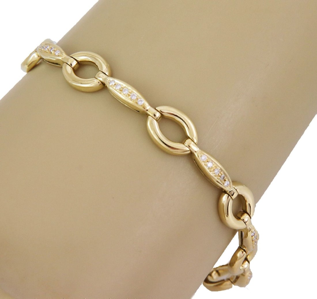 18k Yellow Gold Keren Bar Link Bracelet With Diamonds by Aaron Basha: 18k Yellow Gold Keren Bar Link Bracelet With Diamonds by Aaron Basha This Aaron Basha "Keren" bracelet features an elegant oval bar link design, crafted in solid 18k yellow gold. Adorned with approxim