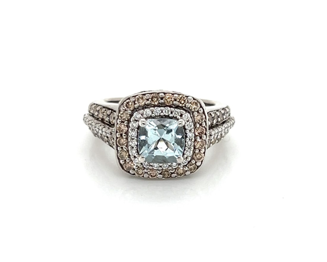 LeVian 14k White Gold Aquamarine and Chocolate Diamond Cocktail Ring Size 4.5: LeVian 14k White Gold Aquamarine and Chocolate Diamond Cocktail Ring Size 4.5 This LeVian cocktail ring features a cushion-cut aquamarine at the center, surrounded by a double-tier halo of white and c