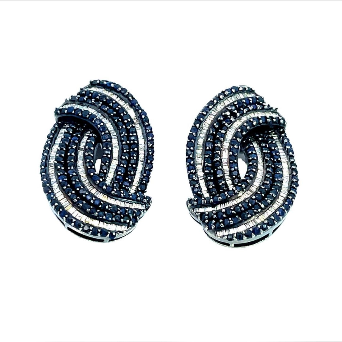Stunning 18k Black Rhodium Interlaced Diamond Sapphire Huggie Earrings: Stunning 18k Black Rhodium Interlaced Diamond Sapphire Huggie Earrings Elevate your style with these stunning Diamond Sapphire Huggie Earrings, crafted from luxurious 18k black rhodium. Each earring f
