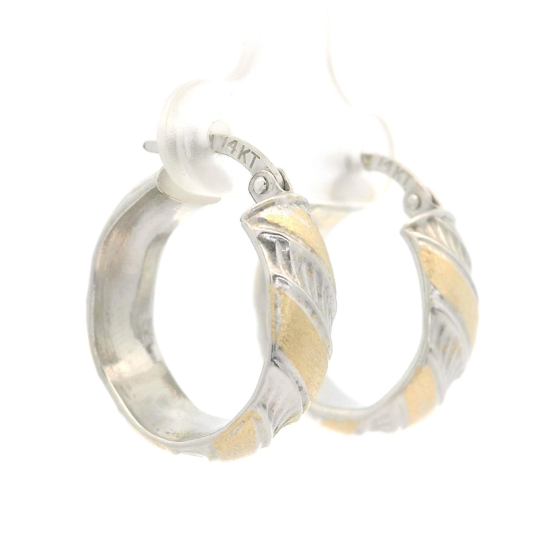 Italian 14k Dual Finish Gold Hoop Earrings with Snap Closure: Italian 14k Dual Finish Gold Hoop Earrings with Snap Closure Experience the elegance of Italian craftsmanship with these classic 14k white and yellow gold dual finish hoop earrings. Crafted from solid