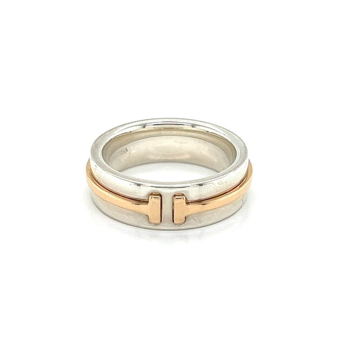 Tiffany T Two Sterling Silver Rose Gold Narrow Band Ring Size 4.5: Tiffany T Two Sterling Silver Rose Gold Narrow Band Ring Size 4.5 This authentic Tiffany & Co. T Two narrow band ring showcases a modern design, crafted in sterling silver and 18k rose gold. Featuring