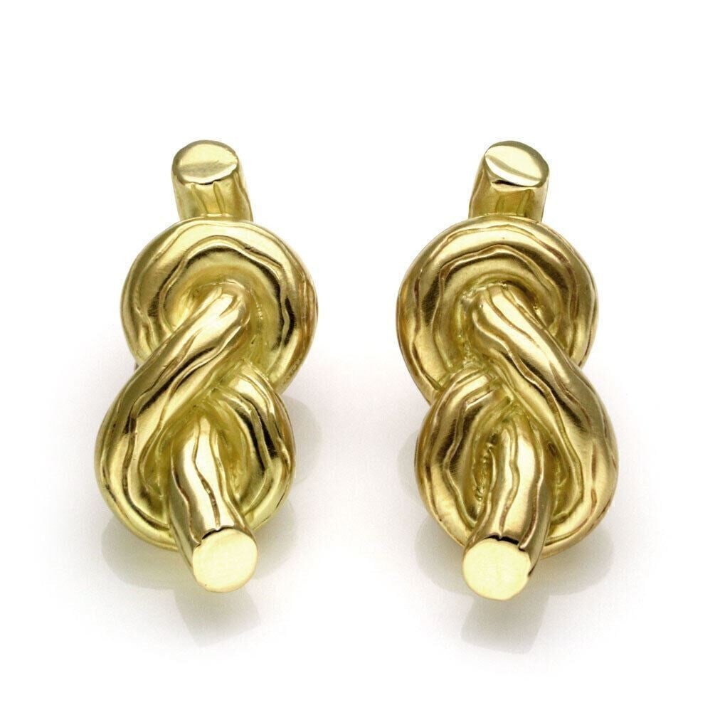 18k Gold Dangle Earrings by Angela Cummings with Sailor Knot Design: 18k Gold Dangle Earrings by Angela Cummings with Sailor Knot Design These Angela Cummings clip-on earrings are crafted from 18k yellow gold and feature a distinctive sailor knot design in a dangle/dro