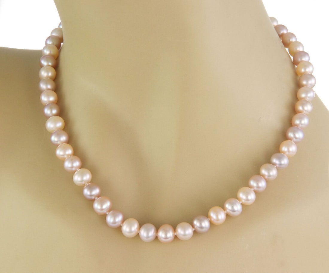 18k White Gold Beaded Pearl Necklace by Tiffany & Co. Signature Collection: 18k White Gold Beaded Pearl Necklace by Tiffany & Co. Signature Collection This Tiffany & Co. Signature necklace features a strand of natural pearls set in 18k white gold. Measuring 16 inches in lengt
