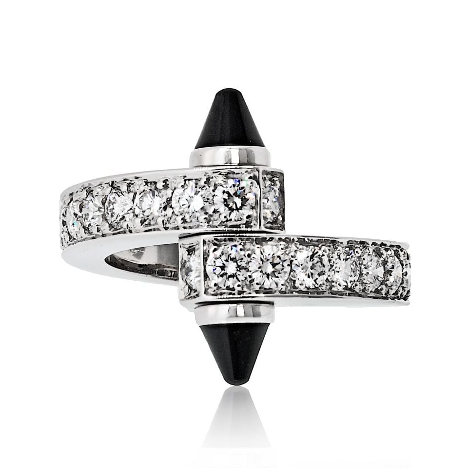 Cartier Menotte Ring 18K White Gold with Diamonds and Onyx: Cartier Menotte Ring 18K White Gold with Diamonds and Onyx This exquisite Cartier Menotte Ring is a stunning example of fine jewelry craftsmanship. Made from luxurious 18K white gold with a high-polis