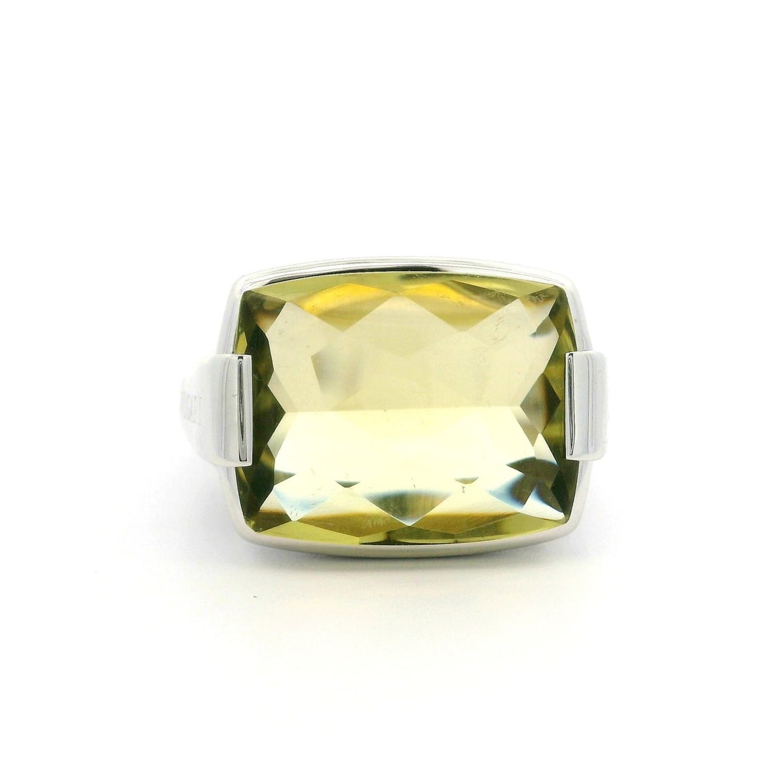 Bvlgari 18k White Gold Lemon Quartz Metropolis Solitaire Ring: Bvlgari 18k White Gold Lemon Quartz Metropolis Solitaire Ring This stunning Bulgari Metropolis Solitaire Ring features a natural lemon quartz gemstone, showcasing a rectangular buff-top cut. The vibra