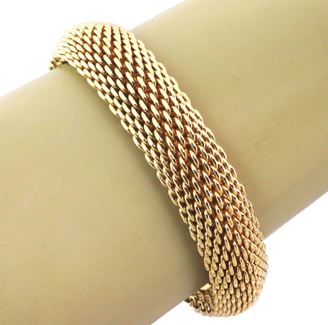 Somerset Mesh Flex Bangle Bracelet in 18k Gold by Tiffany & Co. 16mm Wide: Somerset Mesh Flex Bangle Bracelet in 18k Gold by Tiffany & Co. 16mm Wide This Tiffany & Co. Somerset mesh flex bracelet is expertly crafted from solid 18k yellow gold. Featuring a distinctive wide wo