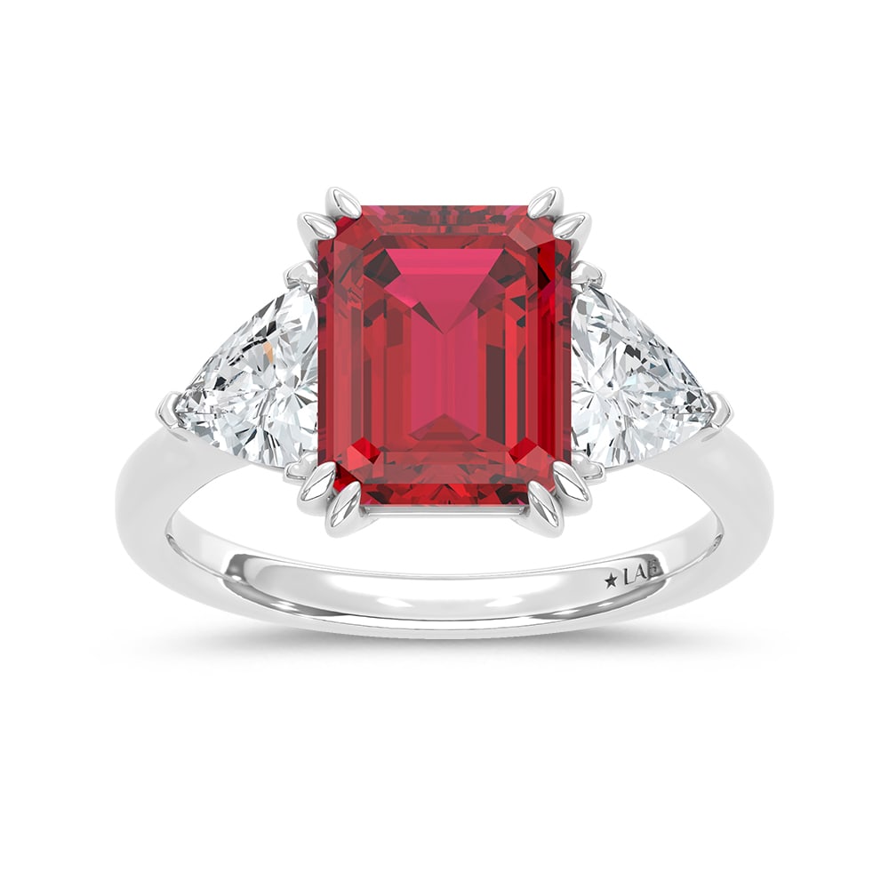 14K White Gold Lab Grown Diamond 5 7/8 Ct.Tw. Emerald Shape Recrystalized Ruby Engagement Ring: 14K White Gold Lab Grown Diamond 5 7/8 Ct.Tw. Emerald Shape Recrystalized Ruby Engagement Ring (Center 4 1/2 ct) Exude refined sophistication with this 14K white gold engagement ring, featuring a stri