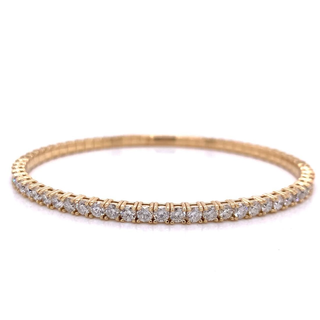 14K Yellow Gold Bangle with 5.70 Ct Diamonds, 67 Stones: 14K Yellow Gold Bangle with 5.70 Ct Diamonds, 67 Stones This exquisite bangle is crafted from 14K yellow gold and features a stunning arrangement of 67 round diamonds, totaling approximately 5.70 cara