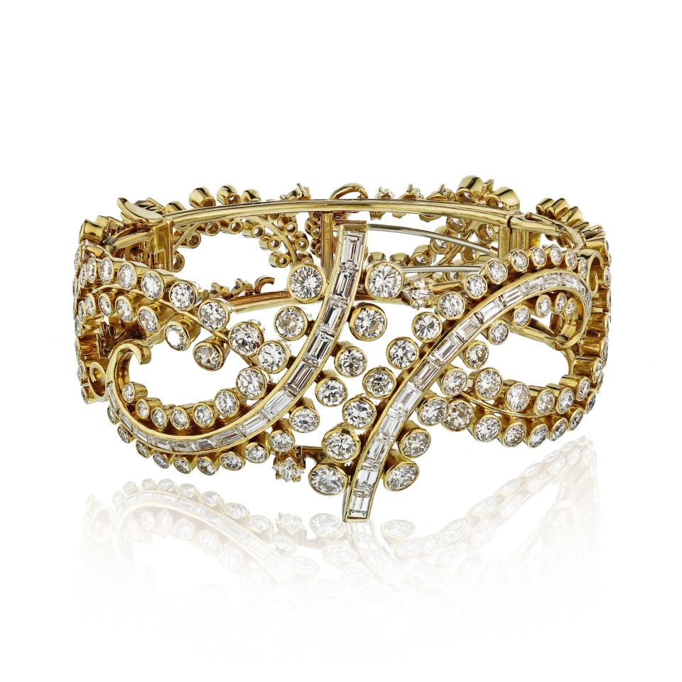 Circa 1980's 18K Yellow Gold 25Cts Diamond Open Framework Bracelet: Circa 1980's 18K Yellow Gold 25Cts Diamond Open Framework Bracelet This exquisite Circa 1980's bracelet is crafted from luxurious 18K yellow gold and features an impressive 25 carats of sparkling roun