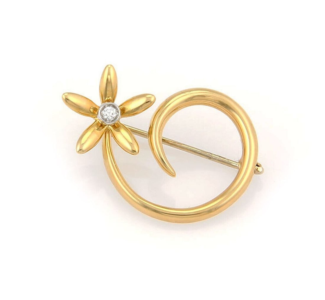 18K Yellow Gold Brooch with Diamond Daisy Spiral by Asprey: 18K Yellow Gold Brooch with Diamond Daisy Spiral by Asprey This original Asprey of London brooch is crafted from 18K yellow gold and features a daisy spiral design accented by a 0.03ct diamond. Signed