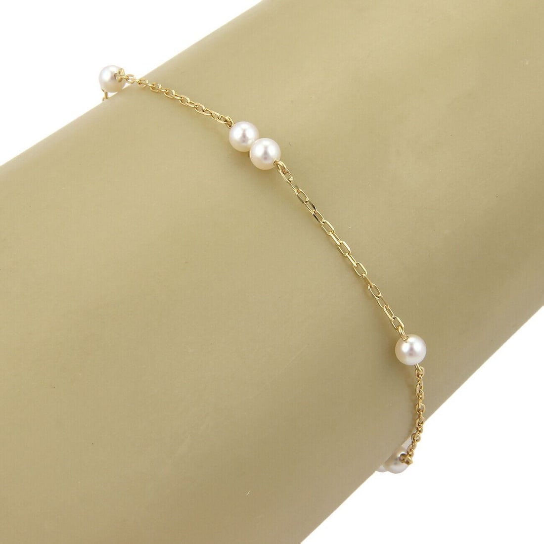 Beaded Akoya Pearl and 14k Yellow Gold Chain Bracelet by Mikimoto: Beaded Akoya Pearl and 14k Yellow Gold Chain Bracelet by Mikimoto This vintage Mikimoto bracelet features 3.5mm Akoya pearls intricately set along a chain link design crafted from 14k yellow gold. Sig