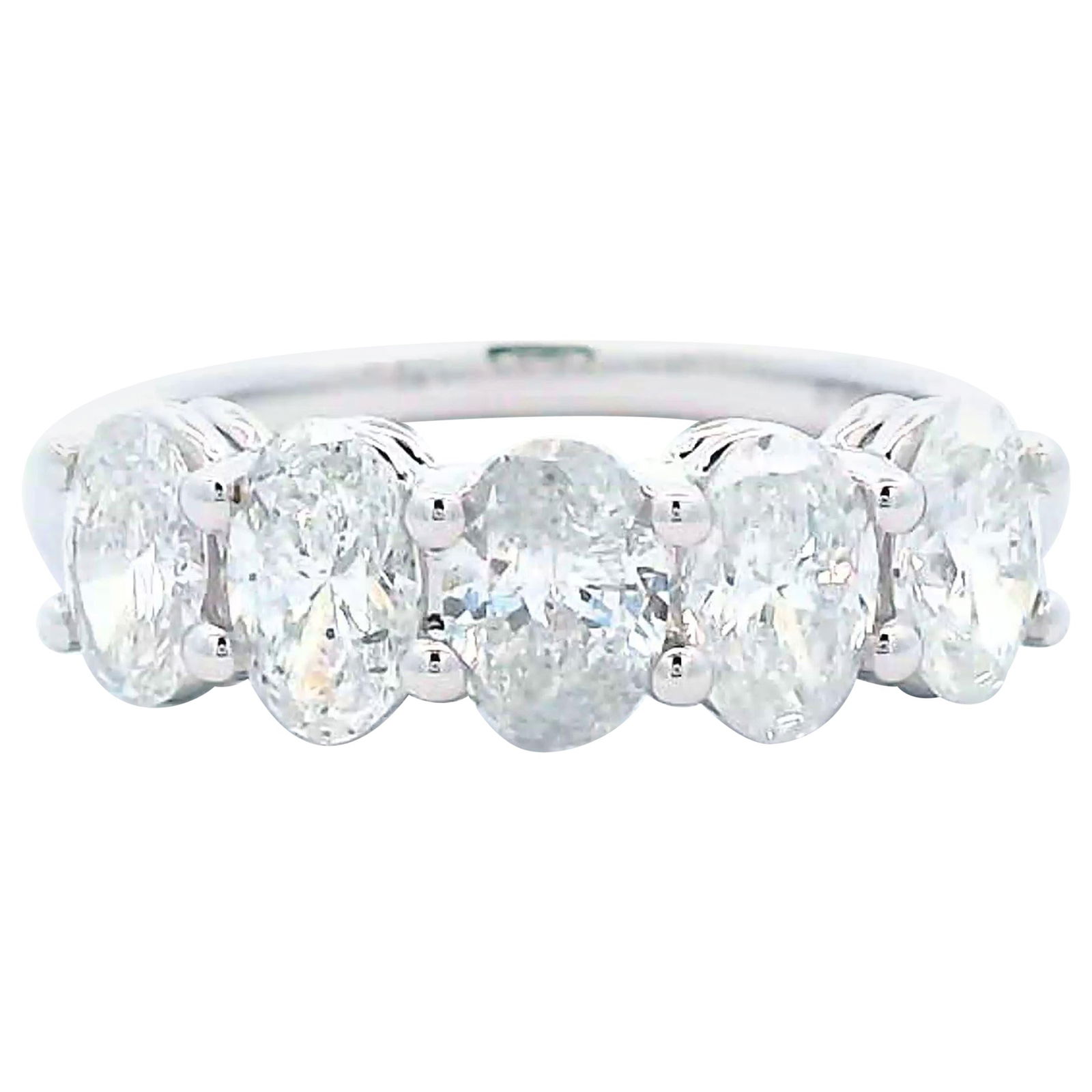 1.48ct Oval Diamond Half Eternity Band 18k White Gold: 1.48ct Oval Diamond Half Eternity Band 18k White Gold This exquisite half eternity band showcases five stunning oval cut diamonds totaling 1.48 carats, featuring F/G color and SI clarity. The ring is