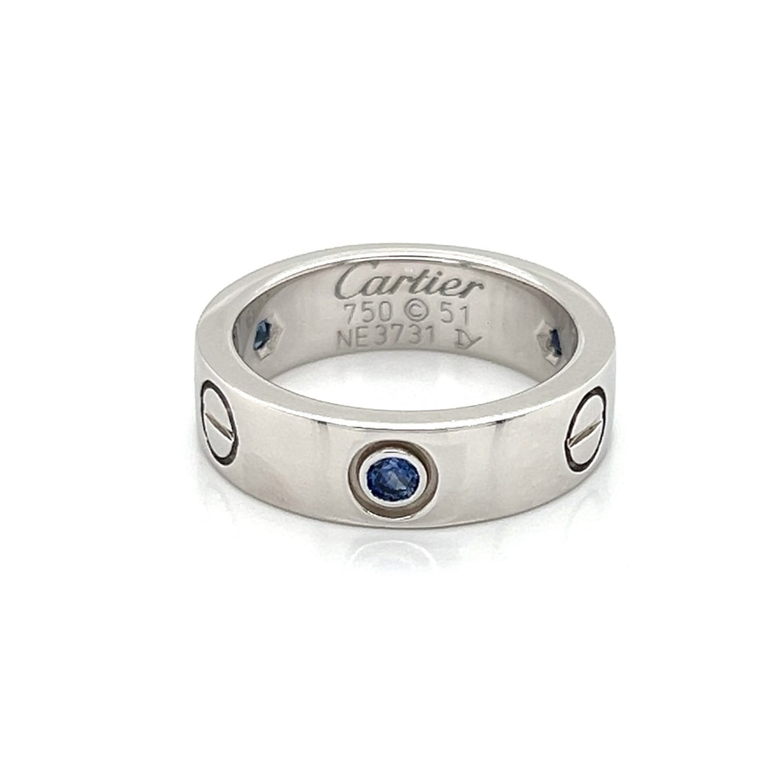 Cartier Love Blue Sapphire Band in 18k White Gold with Papers Size 5.5: Cartier Love Blue Sapphire Band in 18k White Gold with Papers Size 5.5 This rare Cartier Love band ring is expertly crafted from 18k white gold and features a brilliant blue natural sapphire as its ce