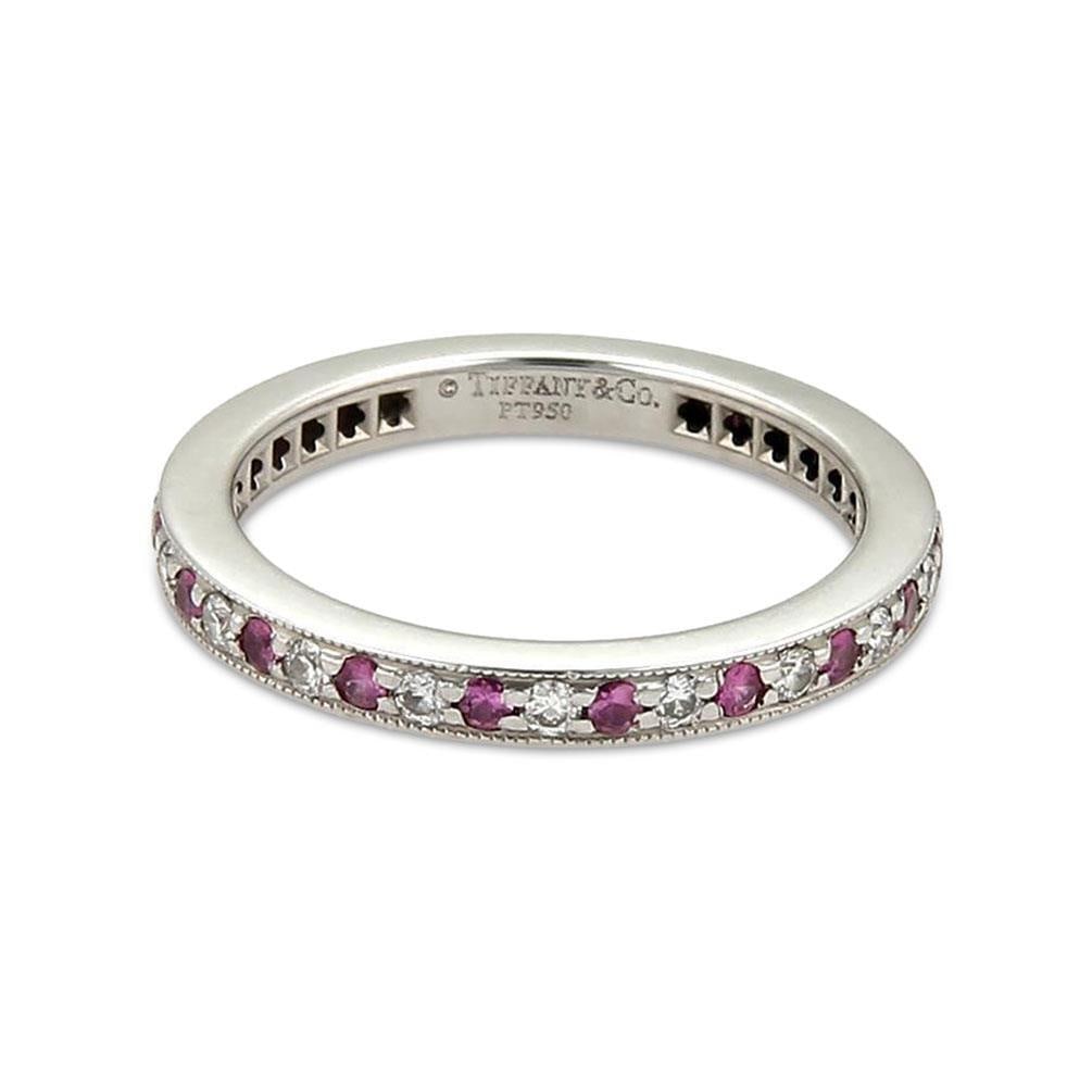 Tiffany & Co. Platinum Diamond Pink Sapphire Eternity Band Ring: Tiffany & Co. Platinum Diamond Pink Sapphire Eternity Band Ring Discover the elegance of this authentic Tiffany & Co. Legacy eternity band ring, crafted in luxurious platinum. This exquisite piece fea