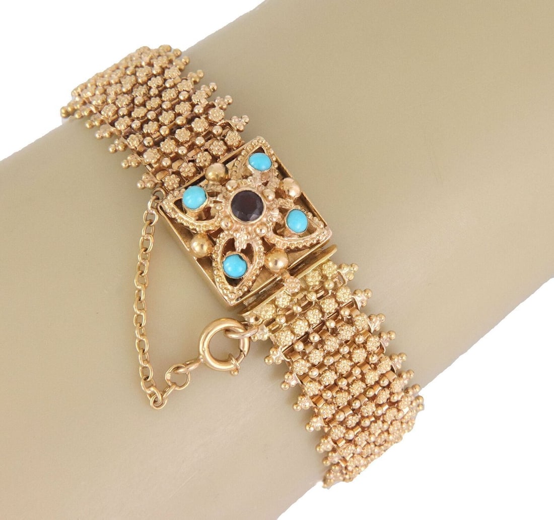 Portuguese 19k Gold Bracelet with Garnet and Turquoise Stones Vintage Chain: Portuguese 19k Gold Bracelet with Garnet and Turquoise Stones Vintage Chain This vintage Portuguese flex bracelet features vibrant garnet and turquoise gemstones set in 19k yellow gold. The chain-styl