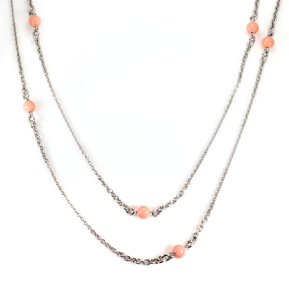 46 Inch Coral Bead Sautoir Necklace in 18k White Gold with Chopard Certificate: 46 Inch Coral Bead Sautoir Necklace in 18k White Gold with Chopard Certificate This Chopard sautoir necklace is crafted from 18k white gold and features coral beads as the main stone. The necklace mea