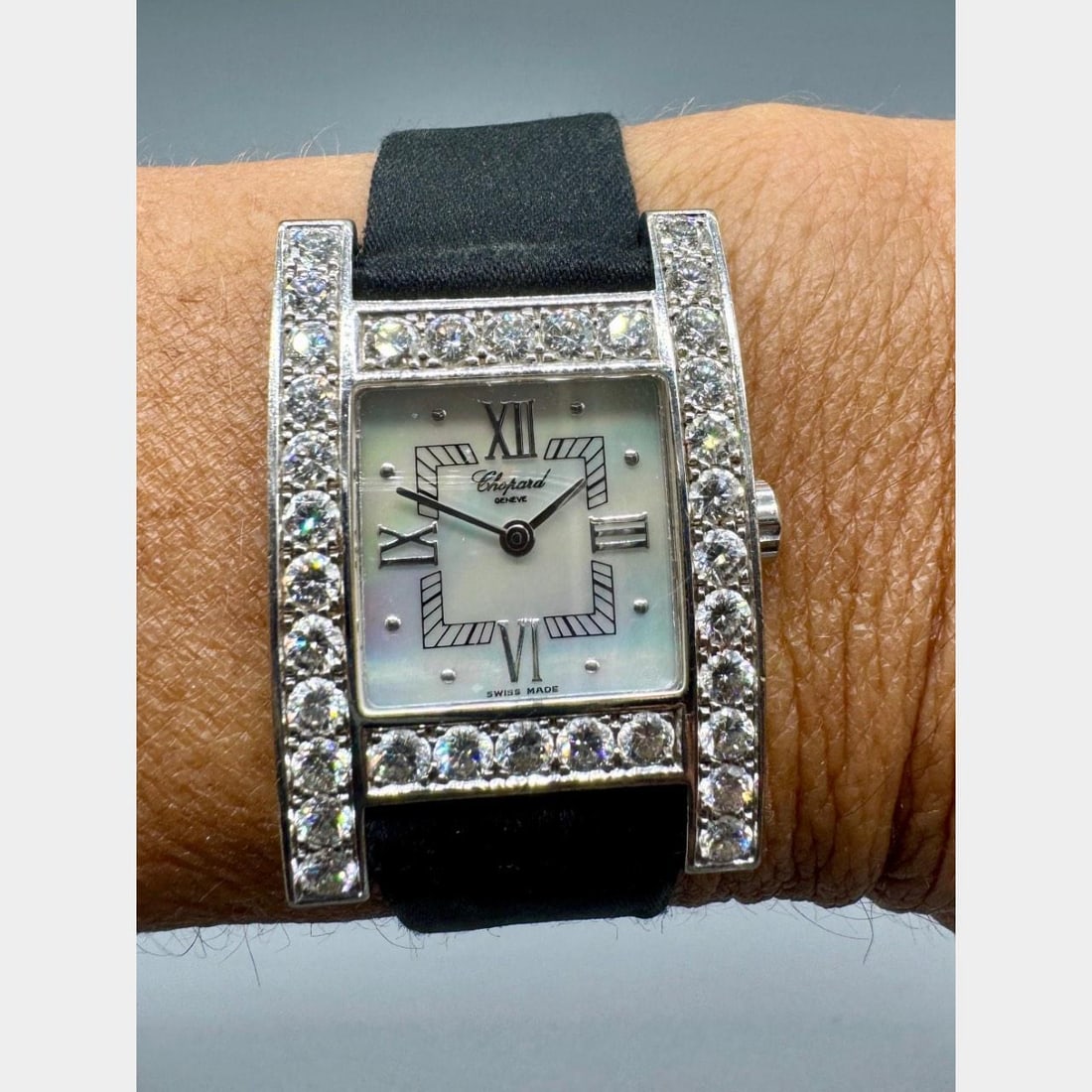 Chopard 18K White Gold Diamond H Watch 34mm Quartz Original Diamonds: Chopard 18K White Gold Diamond H Watch 34mm Quartz Original Diamonds This exquisite CHOPARD H Watch is crafted from 18K white gold and features a stunning original Mother of Pearl dial. It showcases a