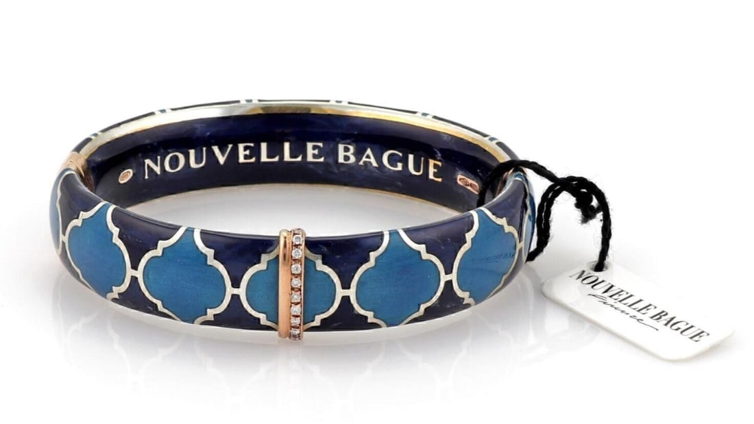 Italian Blue Enamel Diamond Bangle in 18k Gold and Sterling by Nouvelle Bague: Italian Blue Enamel Diamond Bangle in 18k Gold and Sterling by Nouvelle Bague This Nouvelle Bague bangle bracelet features a blue enamel design accented with a diamond. Crafted in Italy from 18k pink