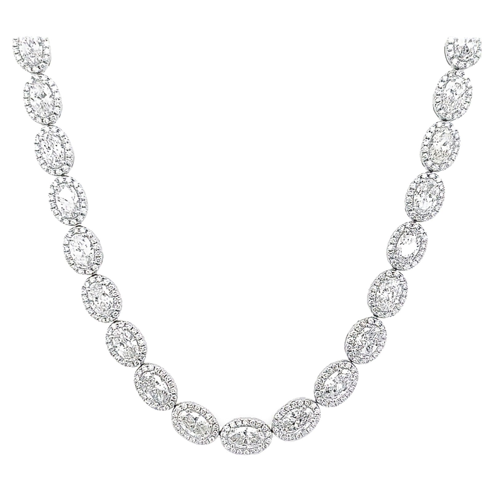 22.18ct Oval Diamond Tennis Necklace 18k White Gold: 22.18ct Oval Diamond Tennis Necklace 18k White Gold This exquisite 22.18ct Oval Diamond Tennis Necklace with Halo is a stunning piece of high jewelry. Crafted from 18k white gold, it features a contem