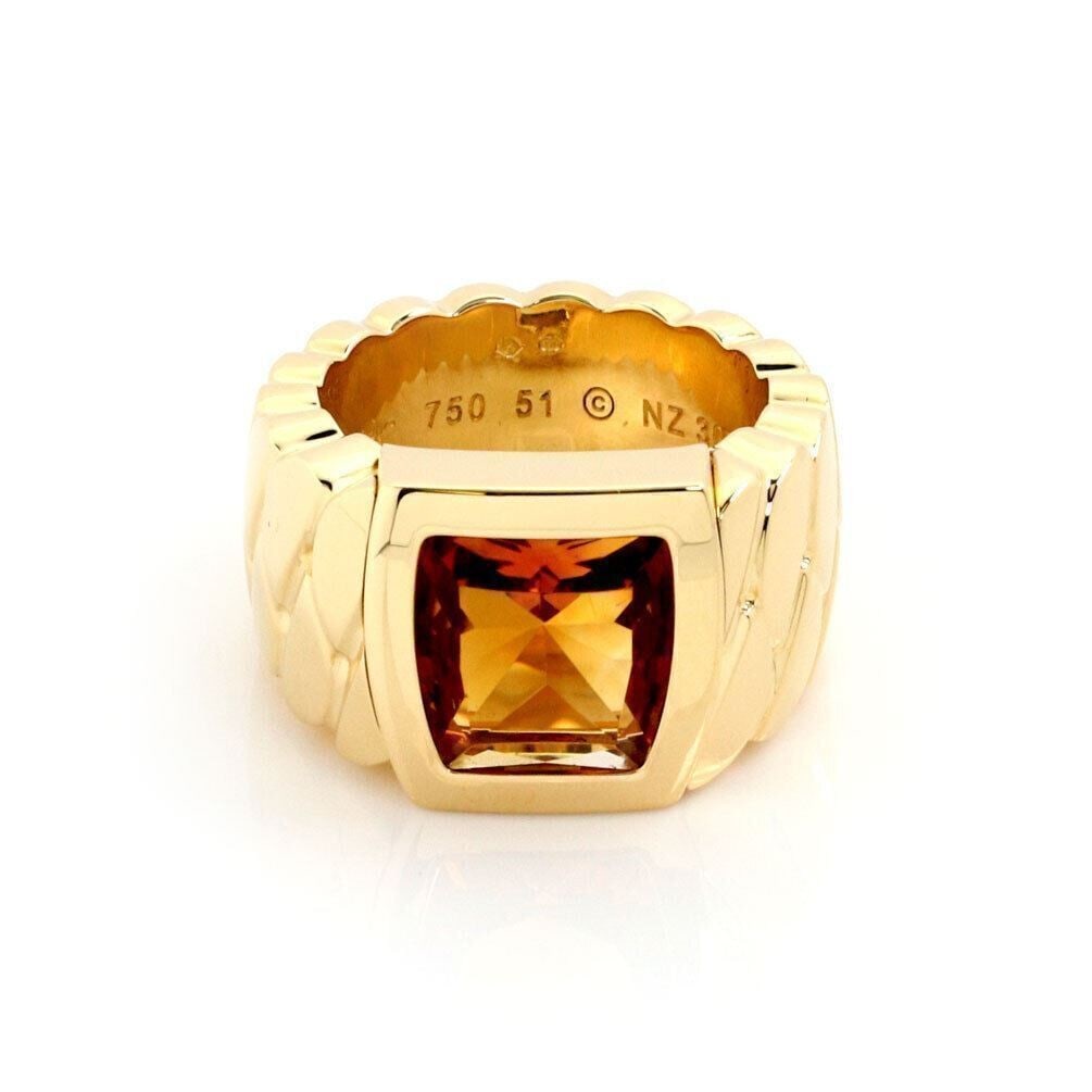 Cartier La Dona Citrine 18k Yellow Gold Band Ring With Paper Size 5.5: Cartier La Dona Citrine 18k Yellow Gold Band Ring With Paper Size 5.5 This Cartier La Dona band ring showcases a vibrant citrine gemstone set in 18k yellow gold. The ring is signed by Cartier and come