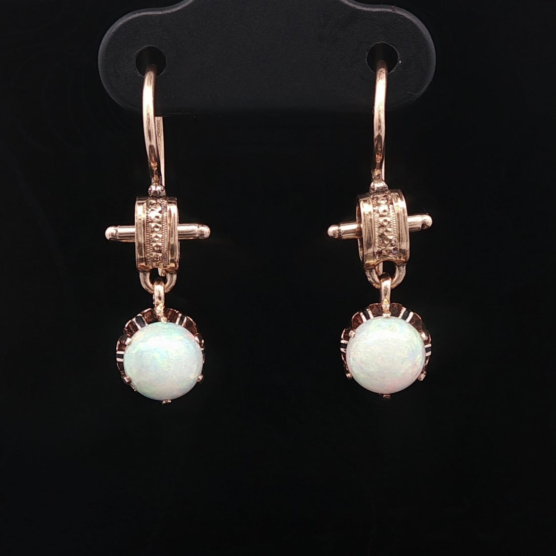 Antique Victorian Yellow Gold Opal Dangle Earrings Natural Cabochon: Antique Victorian Yellow Gold Opal Dangle Earrings Natural Cabochon These exquisite Antique Victorian Rosy Yellow Gold Opal Drop Dangle Hook Earrings are a stunning addition to any jewelry collection.