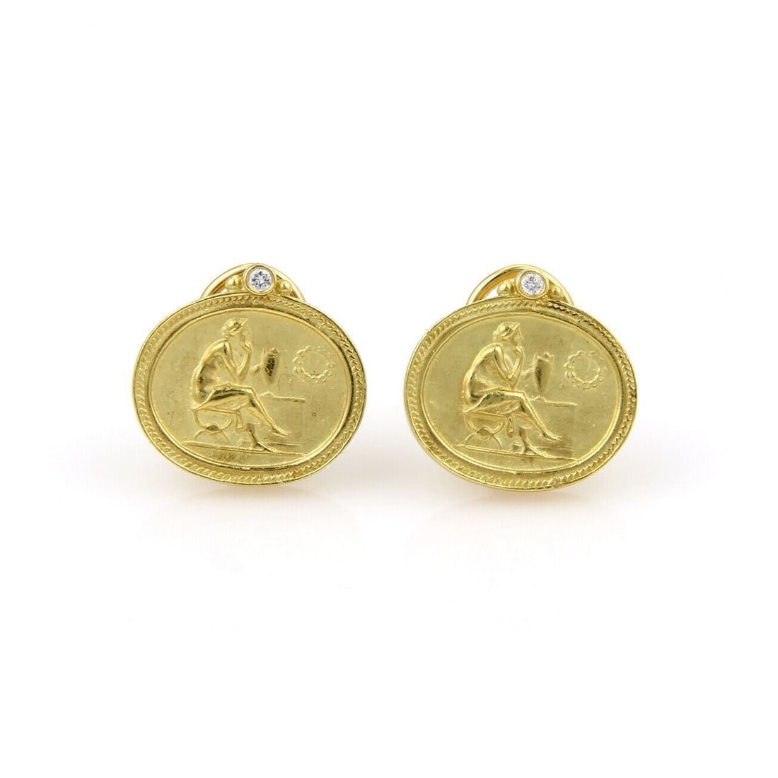 Muse Huggie Earrings in 18k Yellow Gold with Diamonds by Siedengang: Muse Huggie Earrings in 18k Yellow Gold with Diamonds by Siedengang These vintage Siedengang Muse post clip earrings are crafted from 18k yellow gold and accented with diamonds. Designed in a huggie