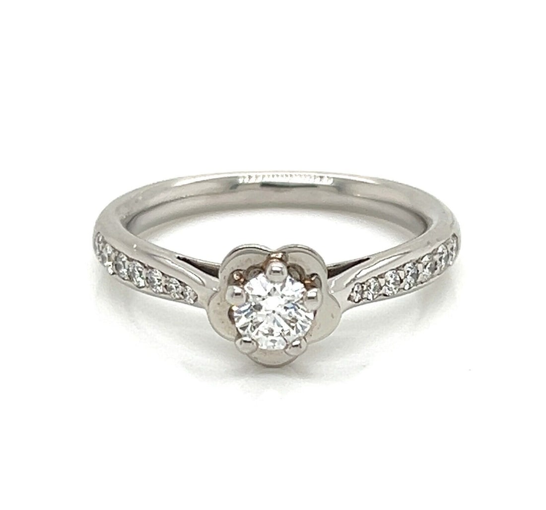 Chanel Camellia Platinum Engagement Ring 0.25ct E VVS2 Diamond GIA Size 5.5: Chanel Camellia Platinum Engagement Ring 0.25ct E VVS2 Diamond GIA Size 5.5 This Chanel Camellia engagement ring is crafted in platinum with a 950 metal purity and features a 0.25 carat center diamond