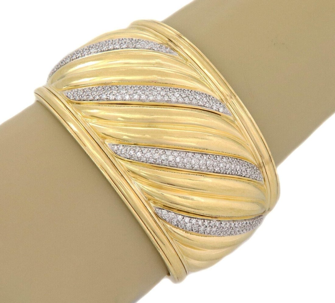 Sculpted Cable Diamond Cuff Bracelet in 18k Yellow and White Gold by David Yurman: Sculpted Cable Diamond Cuff Bracelet in 18k Yellow and White Gold by David Yurman This David Yurman wide cuff bracelet from the Sculpted Cable Collection is crafted from solid 18k yellow gold and feat