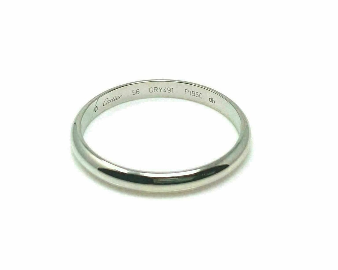 Cartier 1895 Platinum Band Ring Size 7.5 with Certificate: Cartier 1895 Platinum Band Ring Size 7.5 with Certificate This is a vintage Cartier 1895 wedding band crafted in platinum with a purity of 950. The ring is size 7.5 and features a classic, elegant des