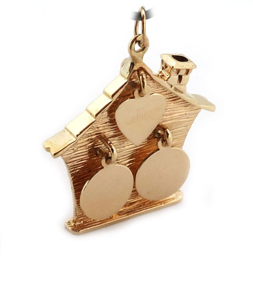 Vintage 14k Yellow Gold House Shaped Dangling Charm Pendant: Vintage 14k Yellow Gold House Shaped Dangling Charm Pendant This vintage pendant features a dangling house motif crafted from 14k yellow gold. With its intricate design and classic appeal, it serves a