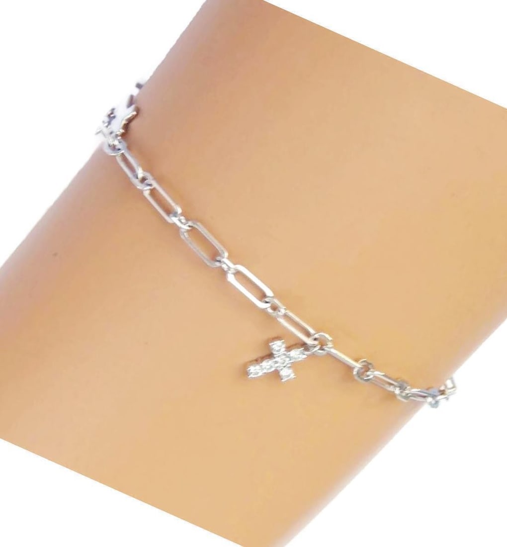 18k White Gold Cross Charm Bracelet with Diamonds by Vendome: 18k White Gold Cross Charm Bracelet with Diamonds by Vendome This Vendome charm bracelet is crafted from solid 18k white gold and features small cross-shaped charms accented with diamonds for a touch