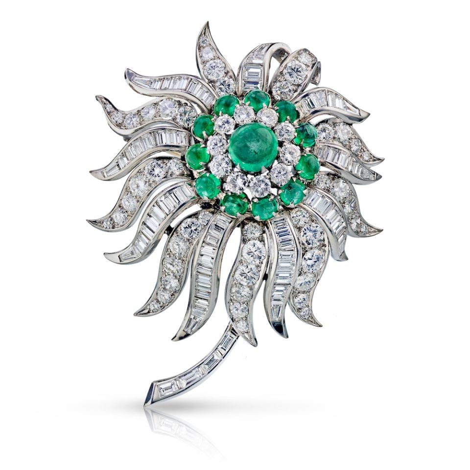 Elegant Platinum Brooch with 15 Carats Diamonds and Emeralds: Elegant Platinum Brooch with 15 Carats Diamonds and Emeralds This exquisite handmade brooch showcases a stunning floral design crafted from luxurious platinum. Adorned with 15 carats of brilliant diam