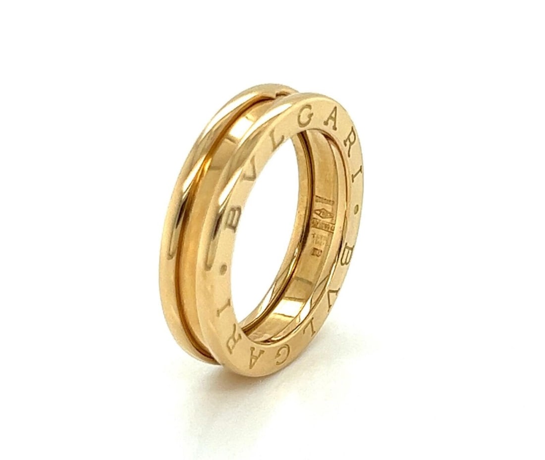 18k Yellow Gold Bvlgari B.zero1 Single Band Ring Size 5: 18k Yellow Gold Bvlgari B.zero1 Single Band Ring Size 5 The Bvlgari B.zero1 One Band Ring is crafted in 18k yellow gold and features a sleek, band-style design. This ring, from the renowned Bvlgari B.