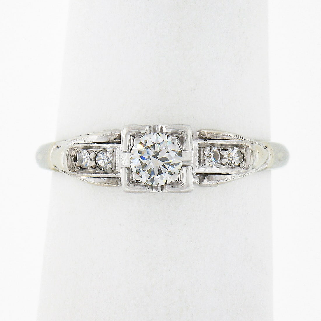 Vintage 14K White Gold 0.26ctw Diamond Solitaire Engagement Ring: Vintage 14K White Gold 0.26ctw Diamond Solitaire Engagement Ring This exquisite vintage engagement ring is crafted from solid 14K white gold and showcases a stunning old transitional cut diamond at it