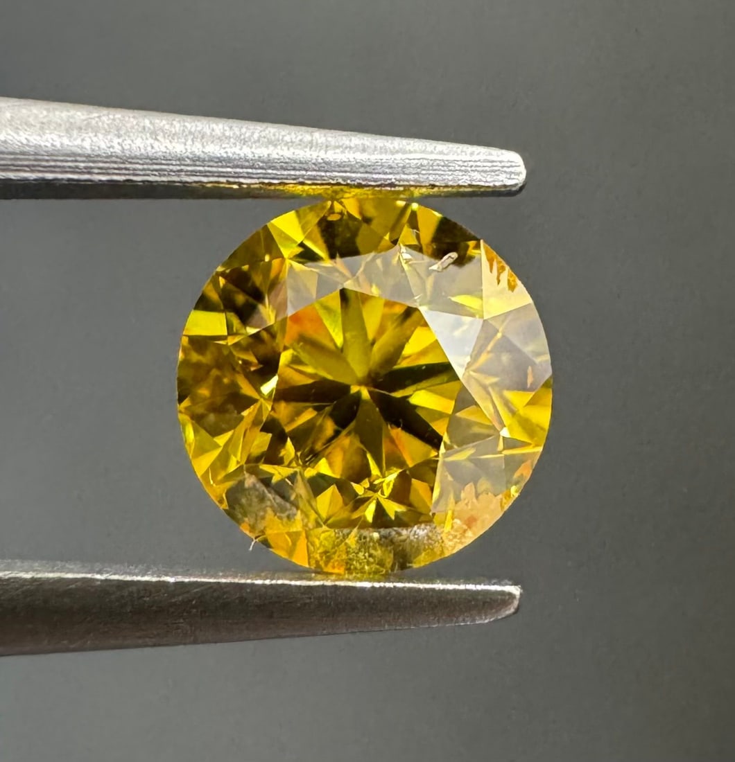 Loose Diamond - ROUND 0.49ct Fancy Vivid Orangey Yellow I1: Loose Diamond - ROUND 0.49ct Fancy Vivid Orangey Yellow I1 Source: Natural Shape: ROUND Carats: 0.49 Color: Fancy Vivid Orangey Yellow Certification: GIA PLEASE NOTE: Framed, Large, or heavy items do