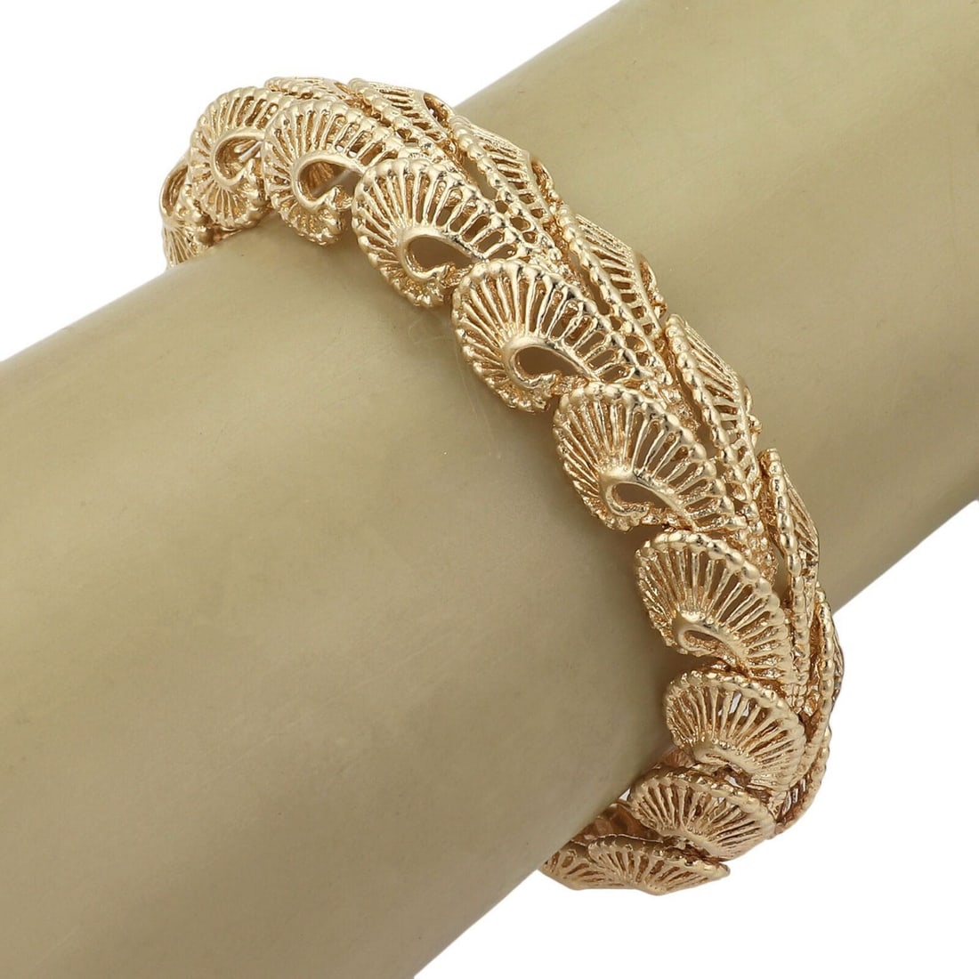 Vintage 14k Yellow Gold Swirl Design 15mm Wide Open Link Bracelet: Vintage 14k Yellow Gold Swirl Design 15mm Wide Open Link Bracelet This vintage bracelet features a fancy open swirl link design crafted from 14k yellow gold. Measuring 15mm wide, it combines timeless