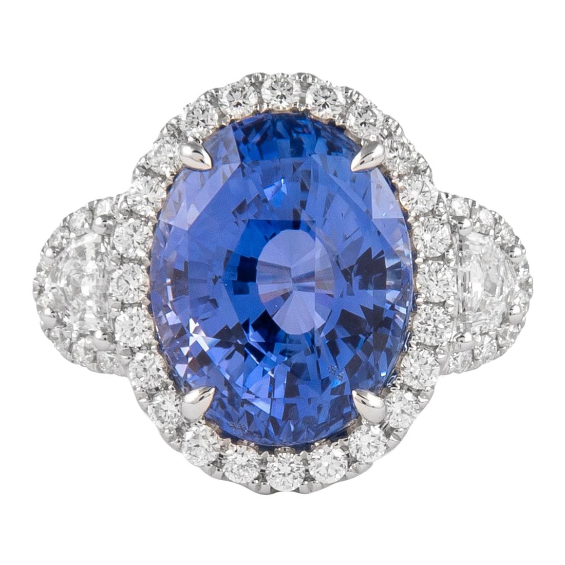 GIA Certified 12.05ct No-Heat Ceylon Sapphire Diamond Halo Ring: GIA Certified 12.05ct No-Heat Ceylon Sapphire Diamond Halo Ring This stunning three stone halo ring features a breathtaking 12.05 ct GIA certified Ceylon sapphire, beautifully complemented by a halo o