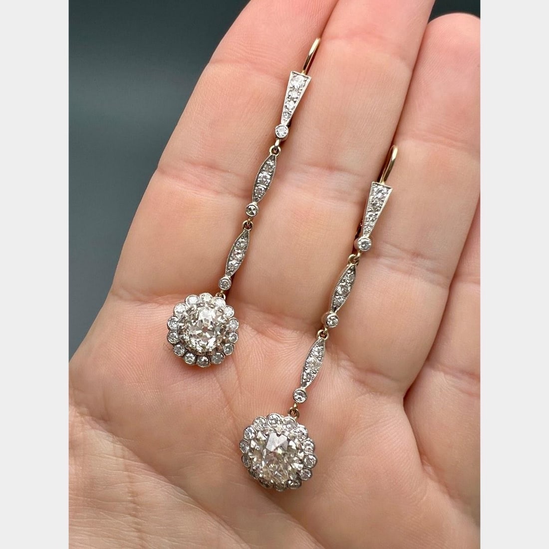 Diamond Drop Earrings in 18K Gold and Platinum with Old Mine Stones: Diamond Drop Earrings in 18K Gold and Platinum with Old Mine Stones Elegant earrings crafted in 18K gold with platinum tops, featuring two old mine cut diamonds totaling approximately 4.50 carats with