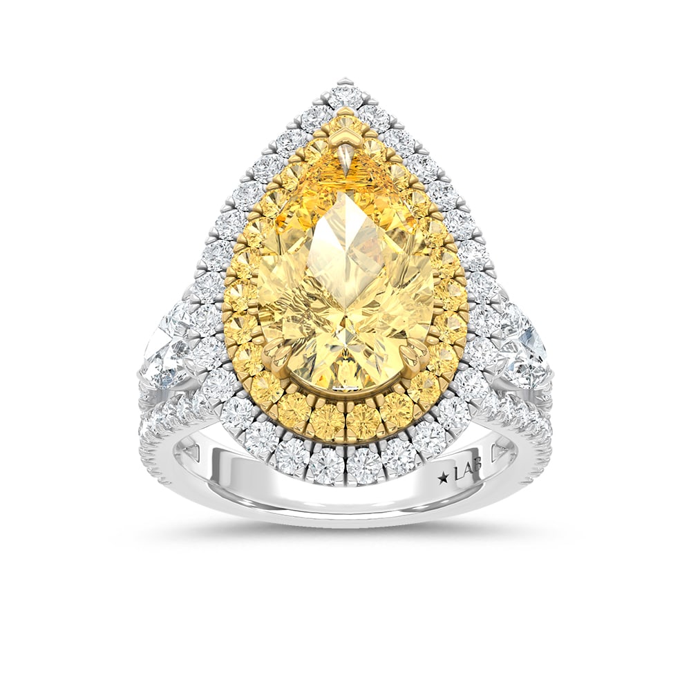 14K Two Tone Lab Grown Diamond 7 3/4 Ct.Tw. Yellow Pear Engagement Ring (Center 5 ct): 14K Two Tone Lab Grown Diamond 7 3/4 Ct.Tw. Yellow Pear Engagement Ring (Center 5 ct) Make a statement of grandeur with this 14K Two-Tone Gold Engagement Ring, featuring a breathtaking 5-carat lab-gro