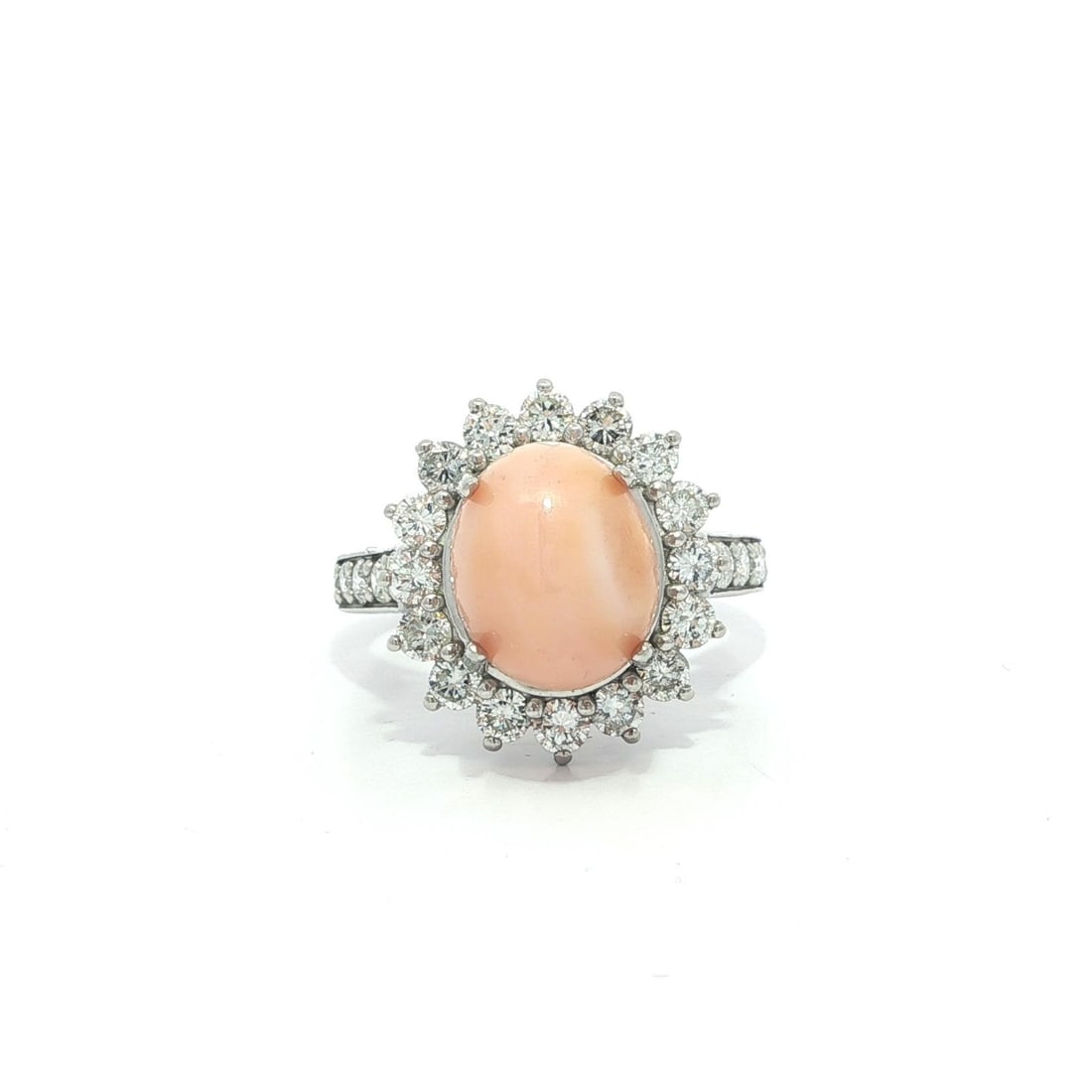 Platinum GIA Certified 6.9ct Natural Pinkish Orange Conch Pearl Diamond Halo Ring: Platinum GIA Certified 6.9ct Natural Pinkish Orange Conch Pearl Diamond Halo Ring This exquisite cocktail ring features a stunning natural pinkish orange conch pearl, beautifully complemented by a dia